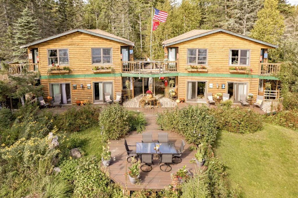 Exterior view of The Inn On Gitche Gumee, showcasing its welcoming entrance and lakefront location as the best hotel in town.